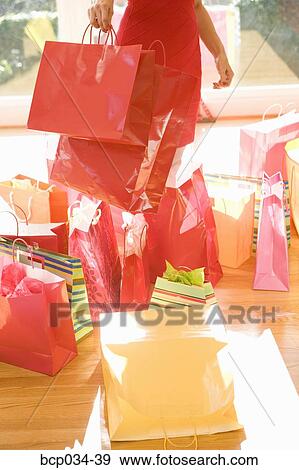 Woman surrounded by shopping bags View Large Photo Image Stock Photo - Woman surrounded by shopping bags. Fotosearch