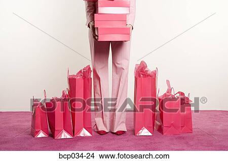 Woman with boxes and shopping bags View Large Photo Image Picture - Woman with boxes and shopping bags. Fotosearch