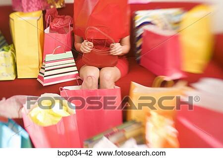 Woman with shopping bag covering her head View Large Photo Image Stock Image - Woman with shopping bag covering her head. Fotosearch