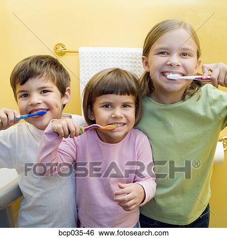 Children brushing teeth together View Large Photo Image Stock Photograph - Children brushing teeth together. Fotosearch