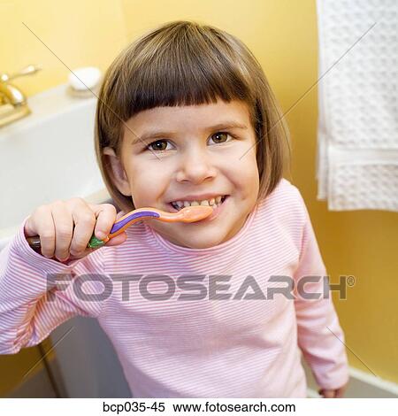 Girl brushing teeth View Large Photo Image Stock Photography - Girl brushing teeth. Fotosearch