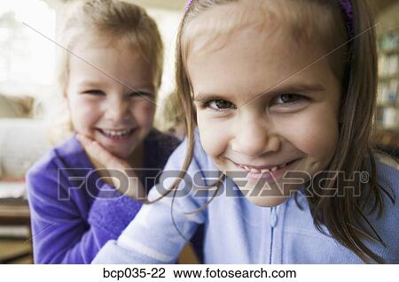 Girls laughing together View Large Photo Image Stock Image - Girls laughing together. Fotosearch