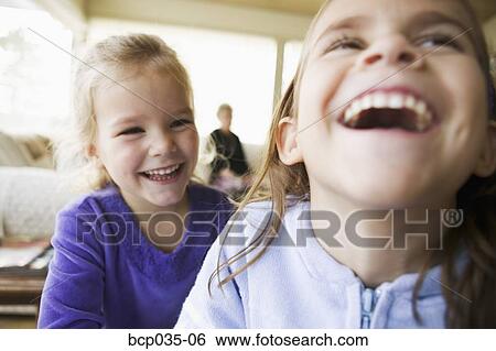 Girls laughing together View Large Photo Image Stock Photograph - Girls laughing together. Fotosearch