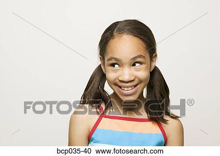 Stock Image - Headshot of smiling girl. Fotosearch