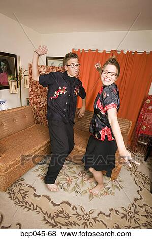 Couple in Asian clothing dancing at home View Large Photo Image Stock Photo - Couple in Asian clothing dancing at home. Fotosearch