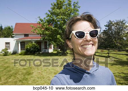 Stock Image - Headshot of woman smiling. Fotosearch
