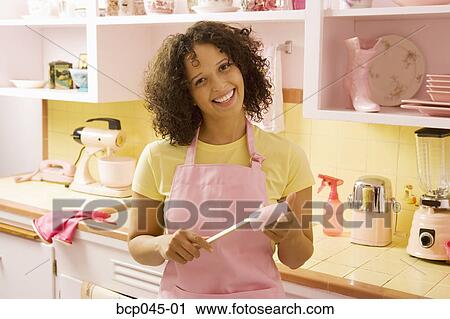 Portrait of woman in kitchen View Large Photo Image Stock Image - Portrait of woman in kitchen. Fotosearch