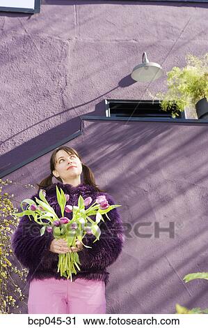 Woman holding bouquet of tulips View Large Photo Image Stock Image - Woman holding bouquet of tulips. Fotosearch