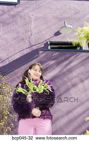 Woman holding bouquet of tulips View Large Photo Image Stock Image - Woman holding bouquet of tulips. Fotosearch