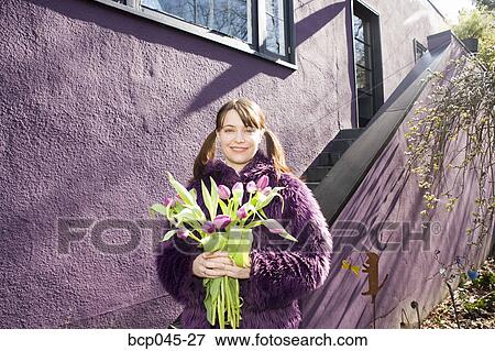 Woman holding bouquet of tulips View Large Photo Image Stock Photo - Woman holding bouquet of tulips. Fotosearch