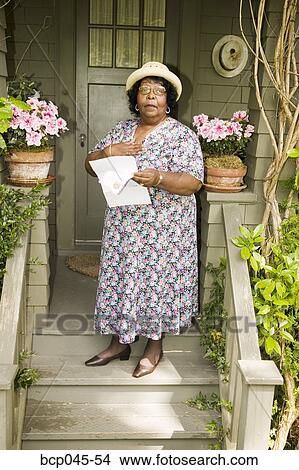 Woman holding letter in hand View Large Photo Image Picture - Woman holding letter in hand. Fotosearch