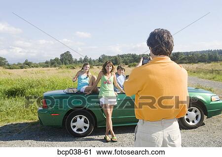 Dad taking snapshot of family View Large Photo Image Stock Image - Dad taking snapshot of family. Fotosearch