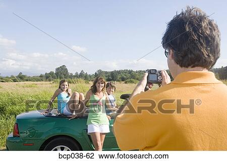Dad taking snapshot of family View Large Photo Image Stock Image - Dad taking snapshot of family. Fotosearch