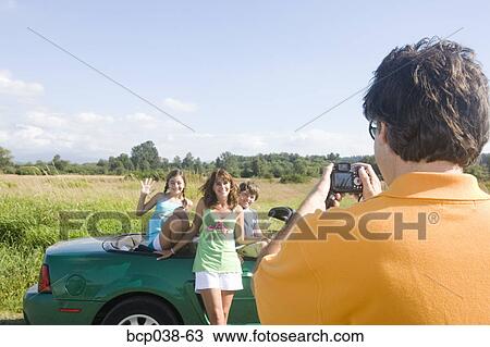 Dad taking snapshot of family View Large Photo Image Stock Image - Dad taking snapshot of family. Fotosearch