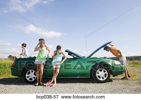 Family coping with car breakdown View Large Photo Image Stock Photo - Family coping with car breakdown. Fotosearch
