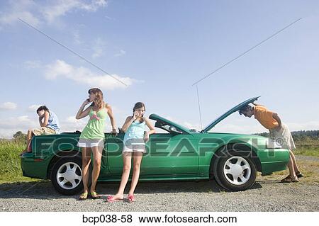Family coping with car breakdown View Large Photo Image Stock Photo - Family coping with car breakdown. Fotosearch