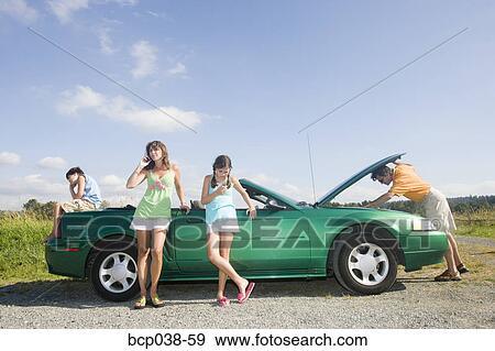 Family coping with car breakdown View Large Photo Image Stock Photo - Family coping with car breakdown. Fotosearch