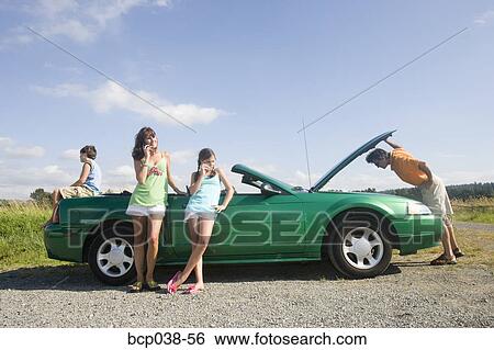 Family coping with car breakdown View Large Photo Image Stock Photograph - Family coping with car breakdown. Fotosearch