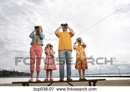 Stock Photo - Family using binoculars. Fotosearch