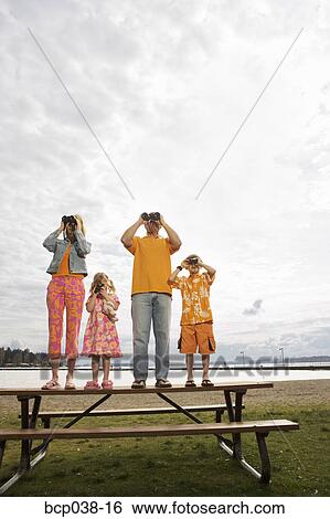 Stock Photograph - Family using binoculars. Fotosearch