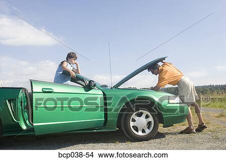 Father and son coping with car breakdown View Large Photo Image Picture - Father and son coping with car breakdown. Fotosearch