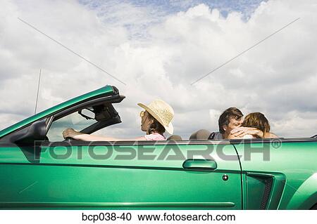Girl pretending to drive while parents kiss View Large Photo Image Stock Image - Girl pretending to drive while parents kiss. Fotosearch