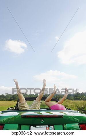 Kids upside down in backseat of car View Large Photo Image Stock Image - Kids upside down in backseat of car. Fotosearch