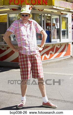 Portrait of a tourist standing outside View Large Photo Image Stock Photograph - Portrait of a tourist standing outside. Fotosearch