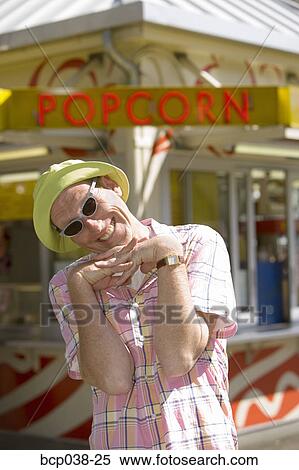 Stock Photography - Portrait of a tourist standing outside. Fotosearch
