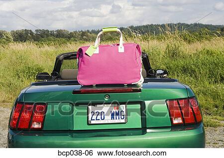 Still life of pink tote bag and car View Large Photo Image Stock Photograph - Still life of pink tote bag and car. Fotosearch