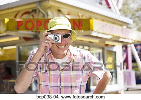 Picture - Tourist taking a photo. Fotosearch