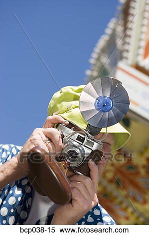 Tourist taking a photo View Large Photo Image Stock Photography - Tourist taking a photo. Fotosearch