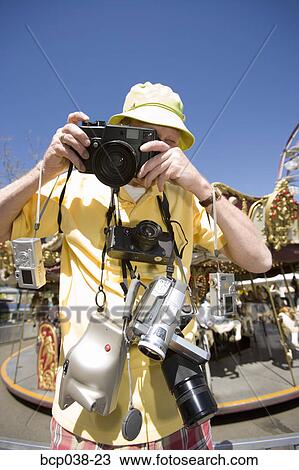 Tourist taking a photograph View Large Photo Image Stock Image - Tourist taking a photograph. Fotosearch