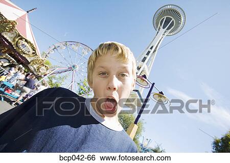 Boy at Space Needle making silly face View Large Photo Image Stock Photograph - Boy at Space Needle making silly face. Fotosearch
