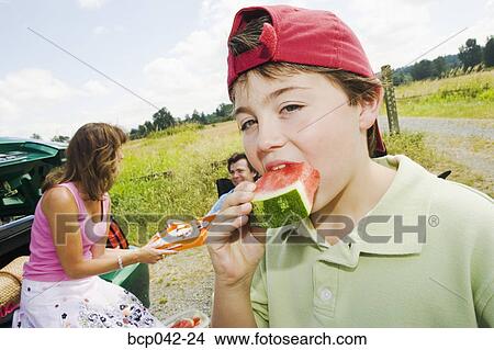 Closeup of boy eating watermelon View Large Photo Image Picture - Closeup of boy eating watermelon. Fotosearch