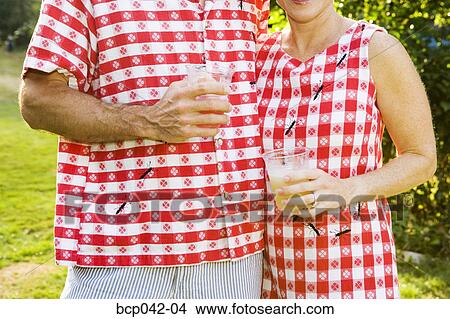 Couple with matching silly picnic clothing View Large Photo Image Picture - Couple with matching silly picnic clothing. Fotosearch