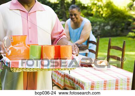 Carrying beverages for a party View Large Photo Image Picture - Carrying beverages for a party. Fotosearch