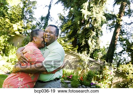 Stock Photo - Couple hugging outdoors. Fotosearch