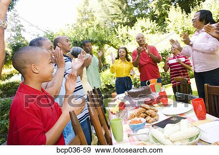 Stock Photo - Enthusiastic family at picnic. Fotosearch