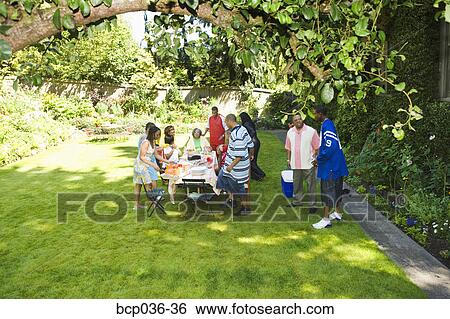 Family preparing for a picnic View Large Photo Image Stock Photograph - Family preparing for a picnic. Fotosearch