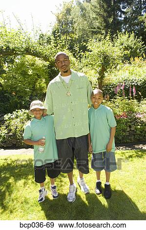 Stock Photo - Father and sons outdoors. Fotosearch