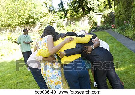 Stock Image - Female family members hugging. Fotosearch