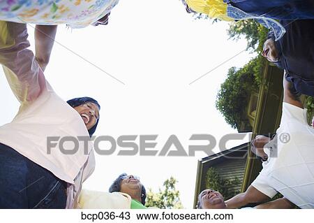 Stock Image - Females in a circle outdoors. Fotosearch
