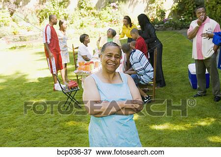 Happy woman at a summer picnic View Large Photo Image Stock Photo - Happy woman at a summer picnic. Fotosearch