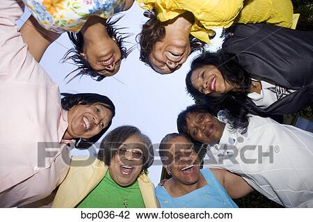 Low angle view of lively females View Large Photo Image Stock Image - Low angle view of lively females. Fotosearch