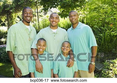 Stock Photo - Males posing for outdoor portrait. Fotosearch