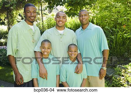 Picture - Males posing outdoors. Fotosearch