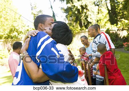 Man and woman hugging outdoors View Large Photo Image Stock Image - Man and woman hugging outdoors. Fotosearch