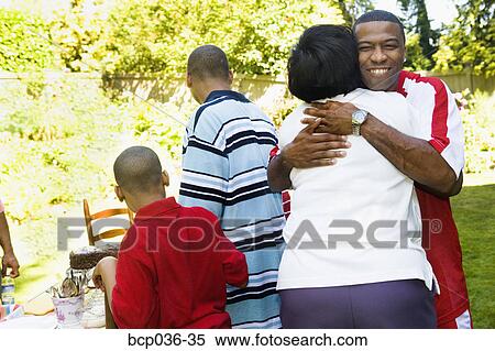 Man and woman hugging outdoors View Large Photo Image Stock Photography - Man and woman hugging outdoors. Fotosearch