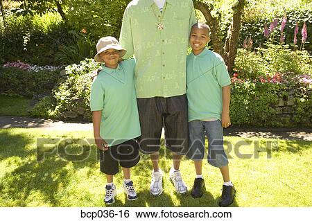 Stock Photograph - Young brothers posing outdoors. Fotosearch